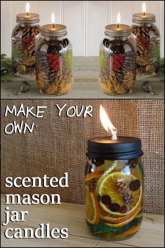 three jars filled with candles sitting on top of a table