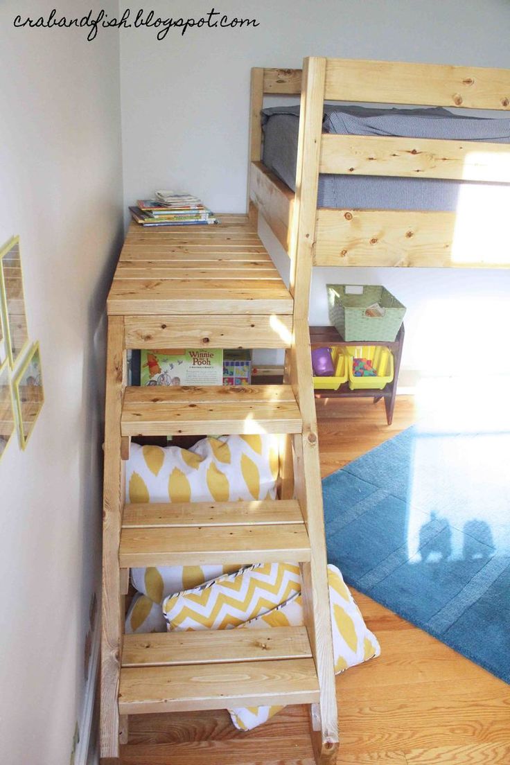 a bunk bed sitting in the corner of a room