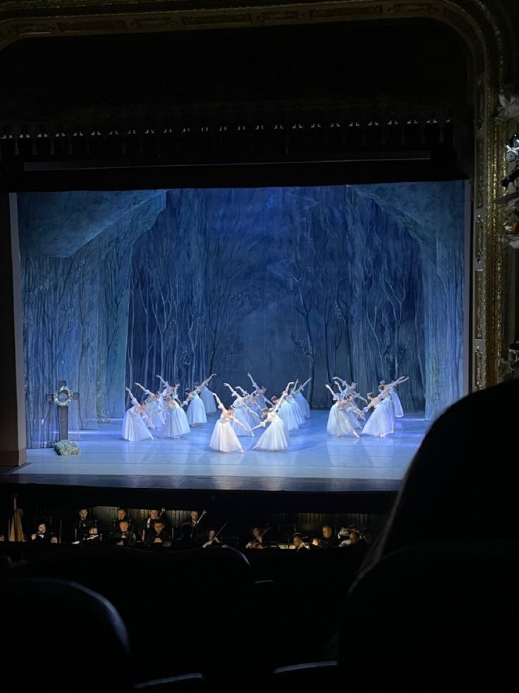 a group of people standing on top of a stage