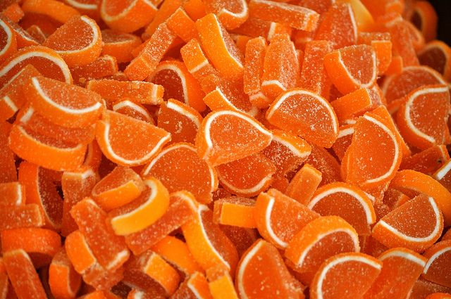 orange slices are piled together in a pile