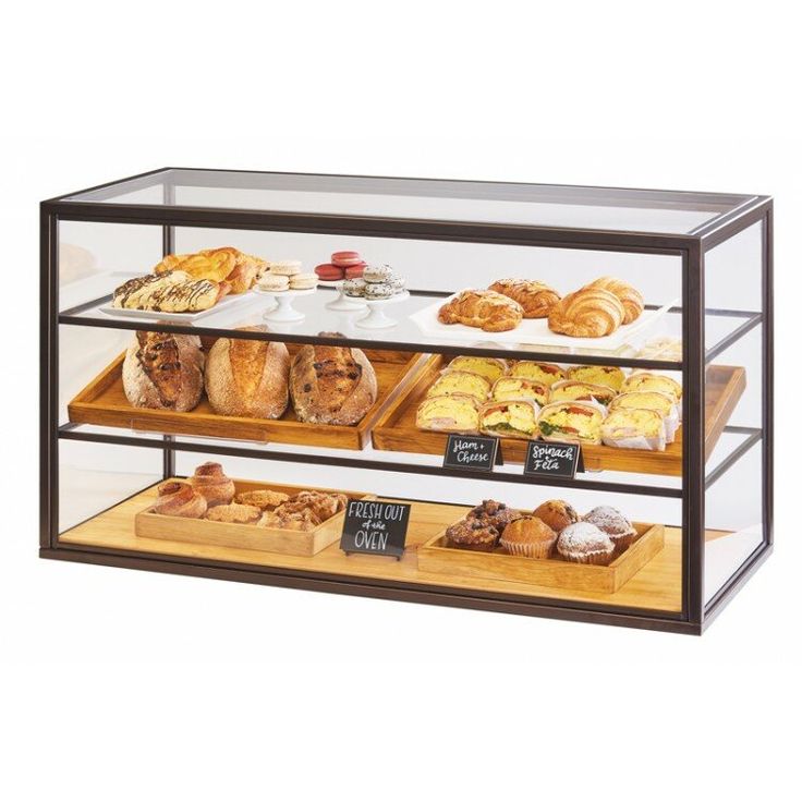 a display case filled with lots of different types of breads and pastries on wooden trays