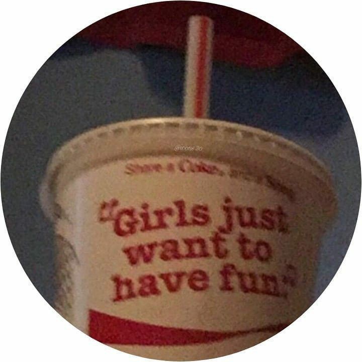 a cup with a straw in it that says girls just want to have fun