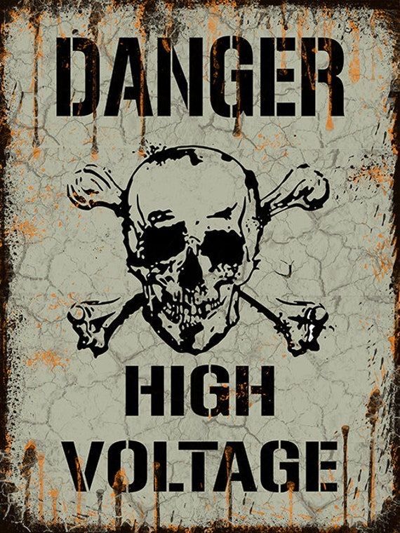 a sign that says danger high voltage with a skull and cross bones on it,