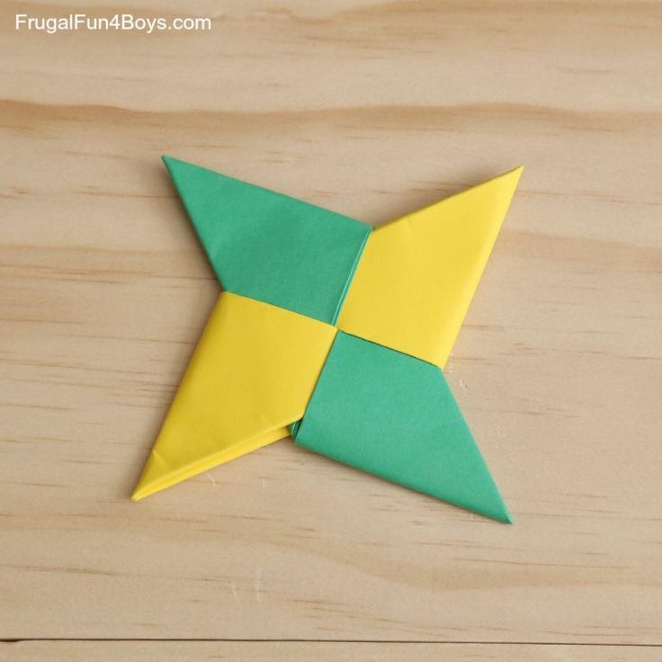 an origami star sitting on top of a wooden table