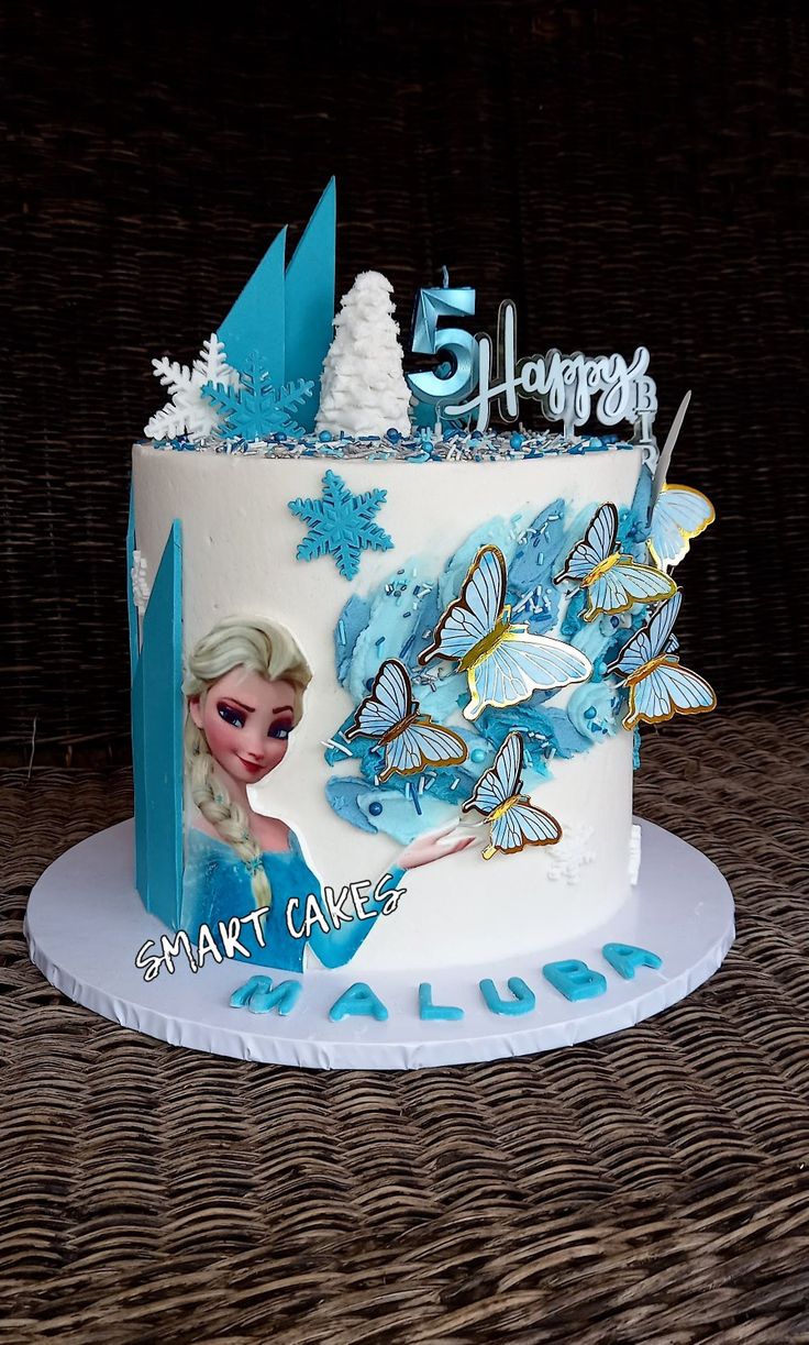 a frozen princess themed birthday cake with butterflies