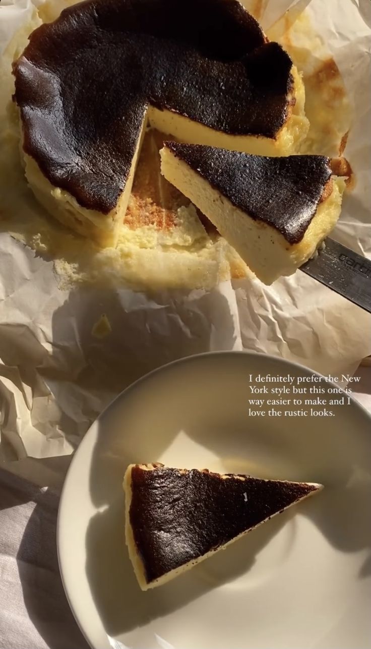 a piece of pie sitting on top of a white plate next to a slice of cake