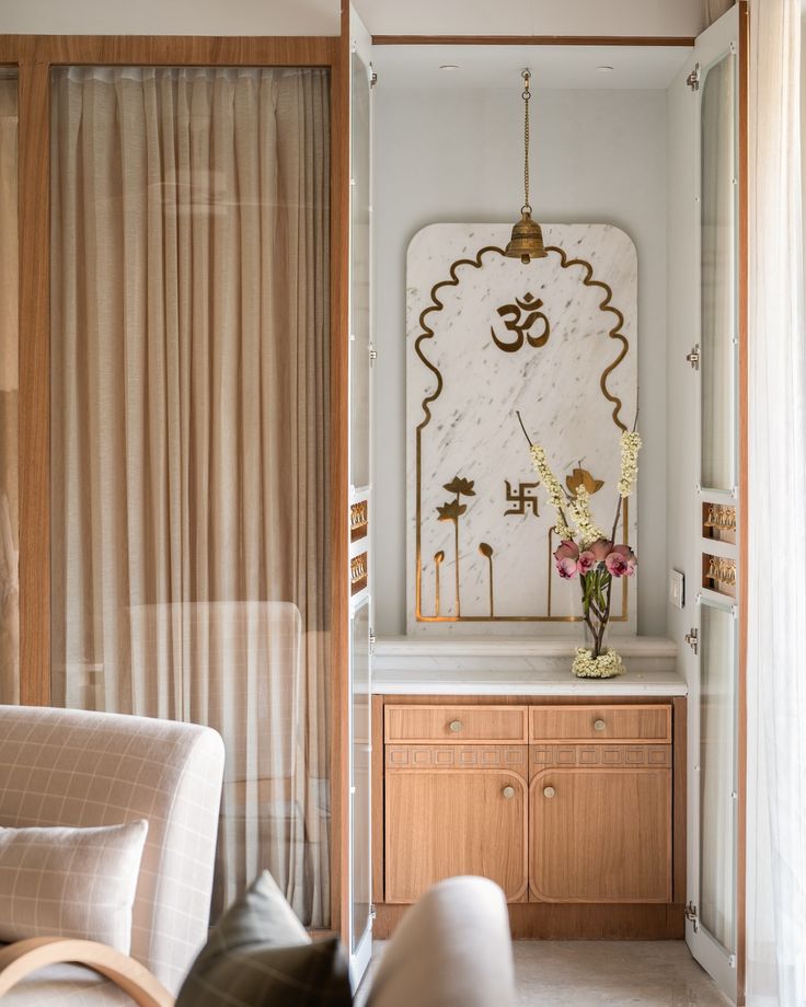 the interior of a living room with white walls and wooden furniture, along with a large mirror on the wall