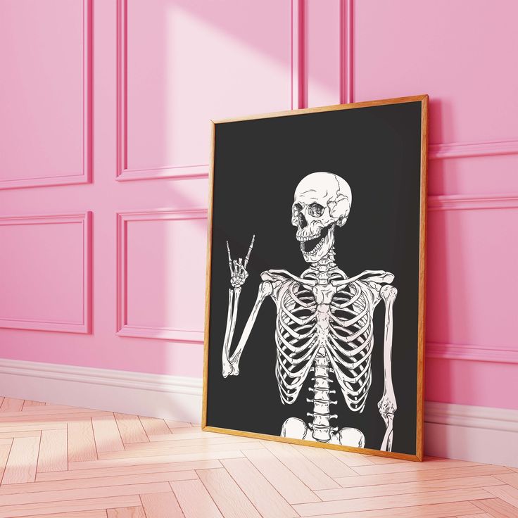 a skeleton is shown in front of a pink wall with a wooden frame on the floor