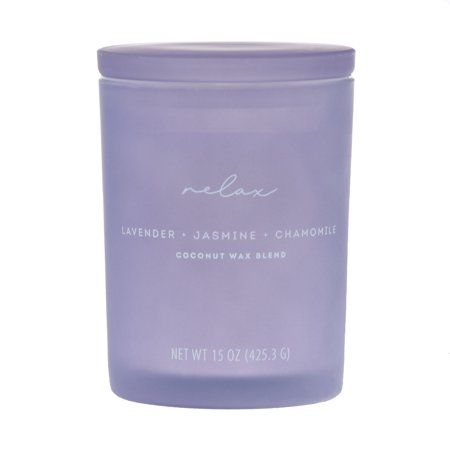 lavender and jasmine chamomi candle in a glass jar on a white background