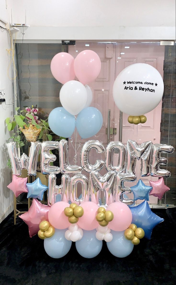 welcome home balloons and stars are on display