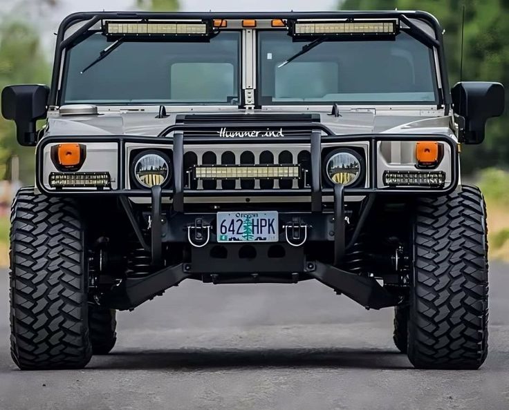 an off - road vehicle is parked on the street