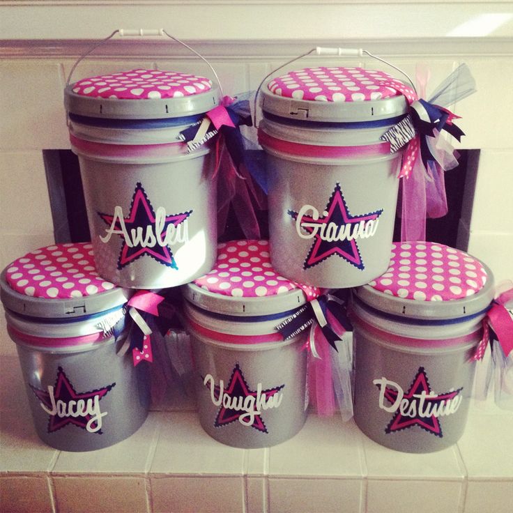 six pink and gray polka dot ice buckets with personalized name on the lids