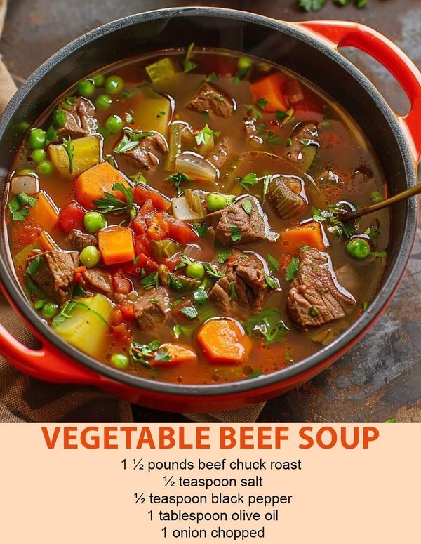 a red pot filled with beef and vegetables