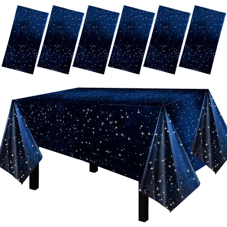 the table cloth is blue with stars on it and there are eight pieces to choose from