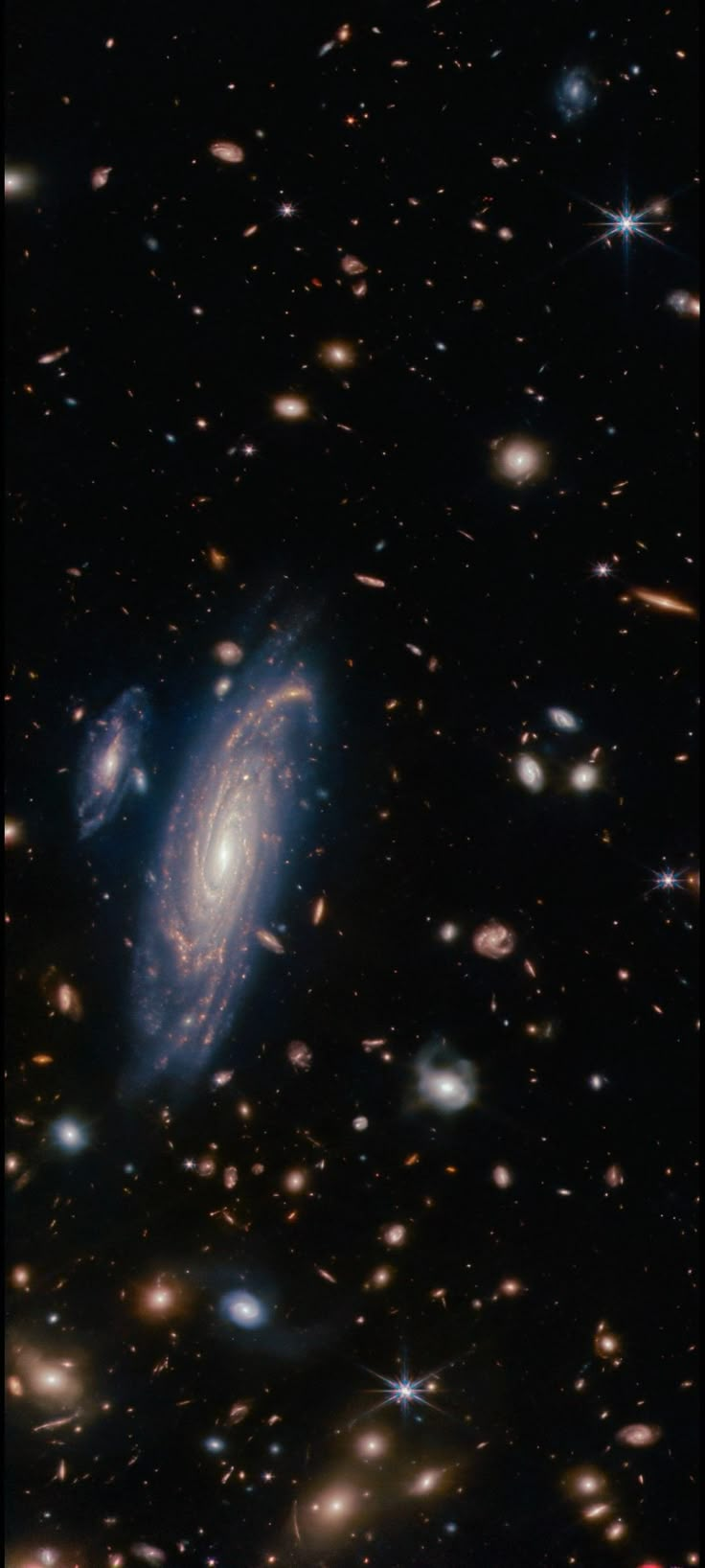 an image of a very large galaxy in the dark night sky with stars all around it