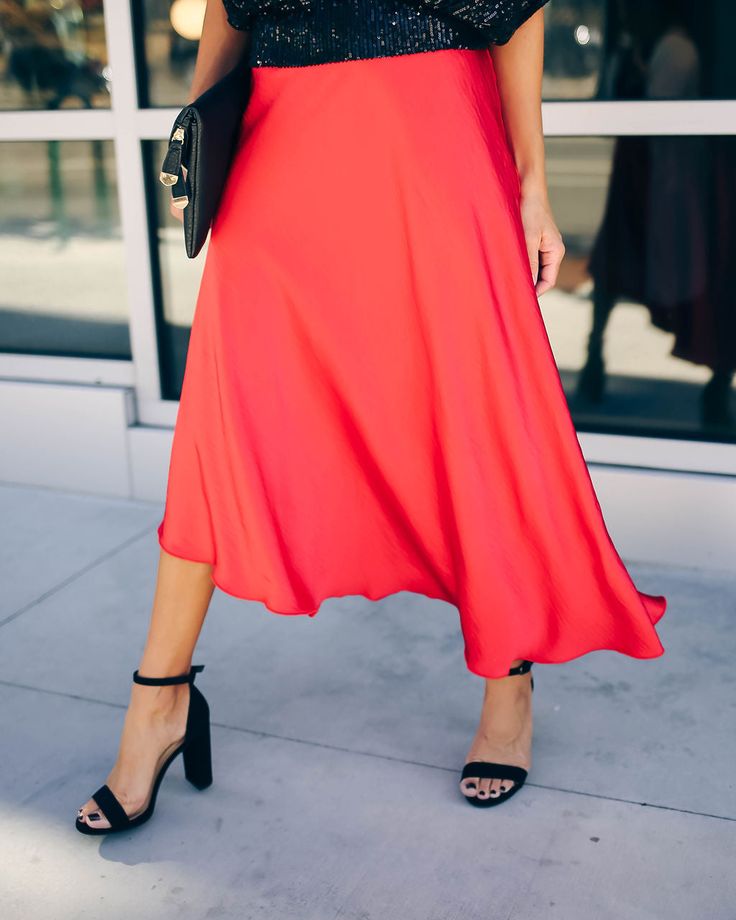 Make a bold statement this party season in our State Of Bliss Satin Asymmetrical Midi Skirt! Crafted in a jewel toned red hue on a soft and satiny base. The relaxed midi silhouette features a structured waistband for defined and comfortable wear. Finished with an asymmetrical hemline and side zipper closure. Styled with the Chloe Mini Necklace. Mosaic Coin Necklace. All Fun And Games Sequin Top. Royale Heels and the Stella Crossbody Envelope Zip Clutch. Relaxed Fit Structured Waistband C Non Ela Asymmetrical Midi Skirt, Mini Necklace, Ribbed Mini Dress, Silver Dress, Sequin Top, Coin Necklace, Waist Size, Midi Length, Shift Dress