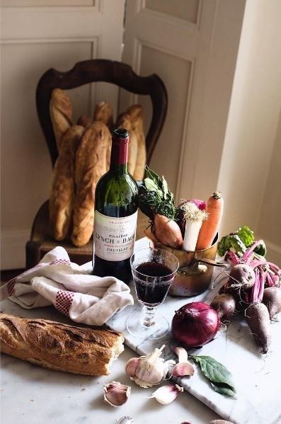 an assortment of food and wine on a table