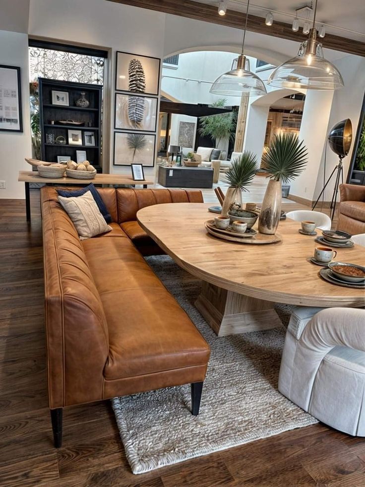 a living room filled with furniture and a wooden table