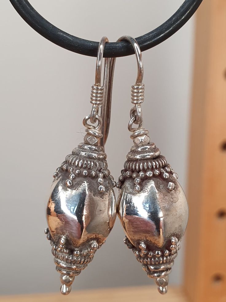 This is a pair of ear-rings bought by myself in Sri Lanka in the 1990's. I bought them to one day (now!) sell, and they have therefore never been worn. The quality of the Sri Lankan silver craftsmanship is in my opinion the very best there is. The quality of the silver Is high (I have had it tested in the past and it always came up above 92.5%, above the requirement to be classed as Sterling silver) and the intricate work of the very unique Sri Lankan style is a pice of history in itself. Throug Hallmarked Dangle Metal Earrings, Hallmarked Metal Dangle Earrings, Collectible Silver Jewelry With Matching Earrings, Ornate 925 Stamped Silver Dangle Earrings, Hallmarked Metal Earrings For Anniversary, Vintage Teardrop Earrings Stamped 925, Vintage Teardrop Stamped 925 Earrings, Antique Silver Oval Earrings, Antique Oval Silver Earrings