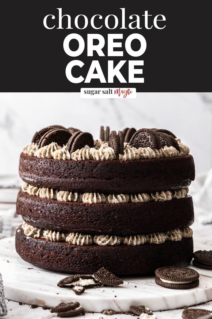 a chocolate oreo cake is stacked on top of each other and topped with cookies