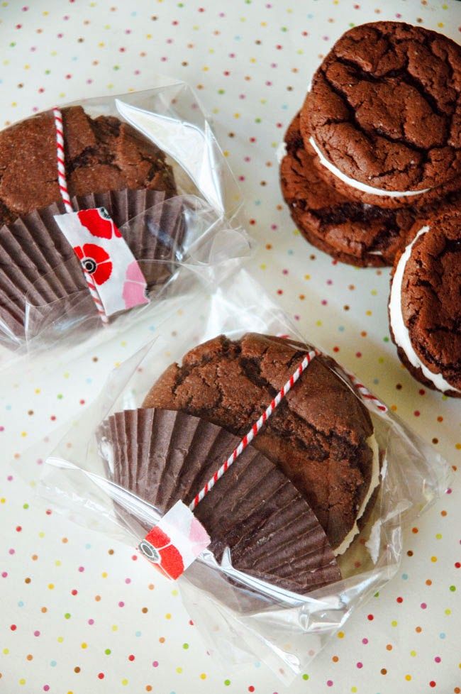 three chocolate cookies wrapped in plastic wrappers