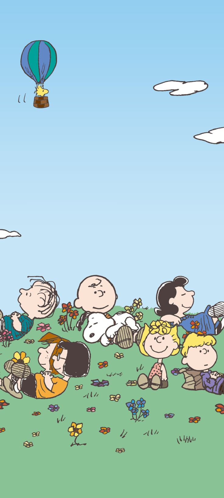 a group of cartoon characters sitting on top of a grass covered field next to a hot air balloon