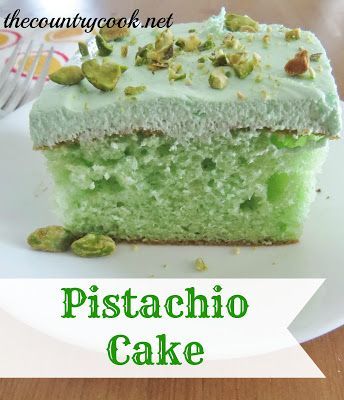 a piece of pistachio cake sitting on top of a white plate