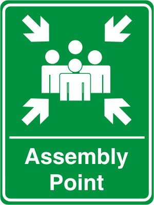 an assembly point sign with arrows pointing in different directions