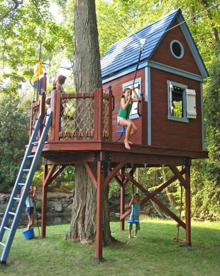 children playing in a tree house with ladders and climbing bars on the top floor