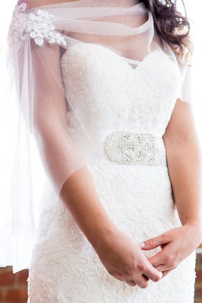 a woman in a wedding dress and veil