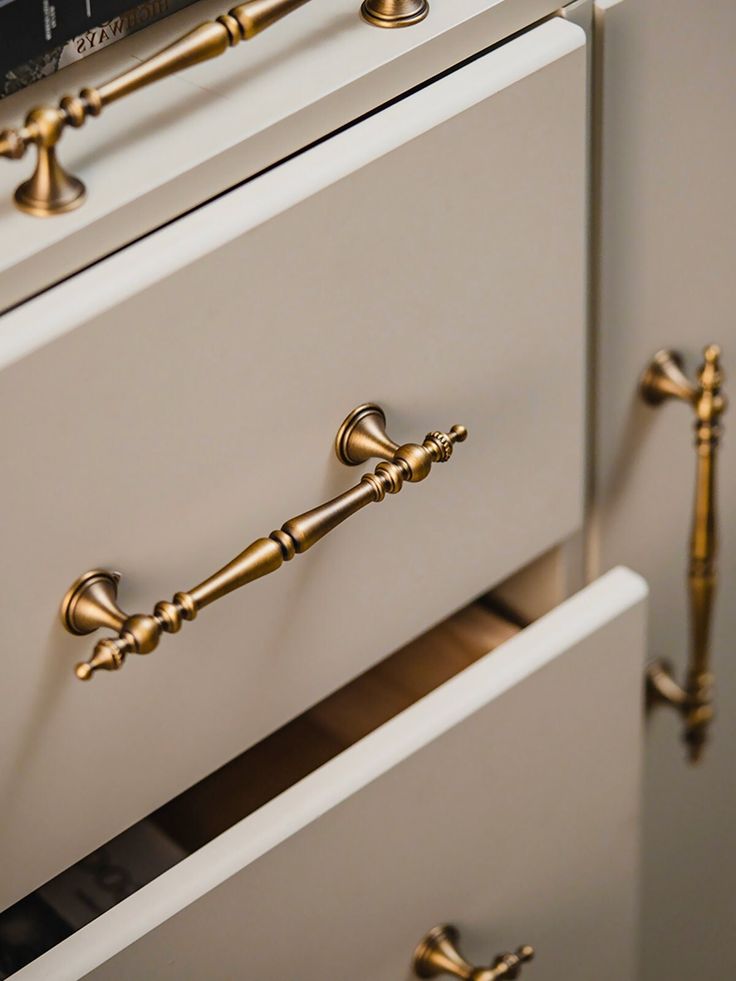 two drawers with brass handles and knobs