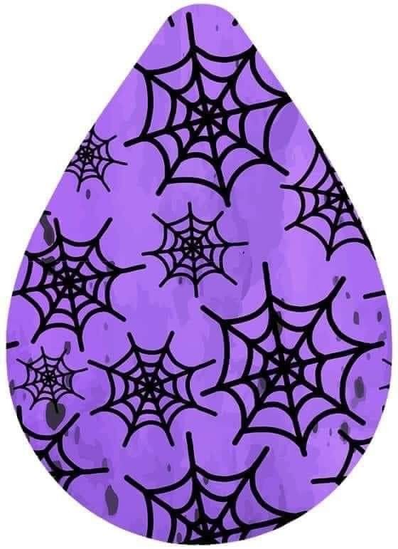 an image of a spider web pattern on a purple tear shaped paperweight with black splots