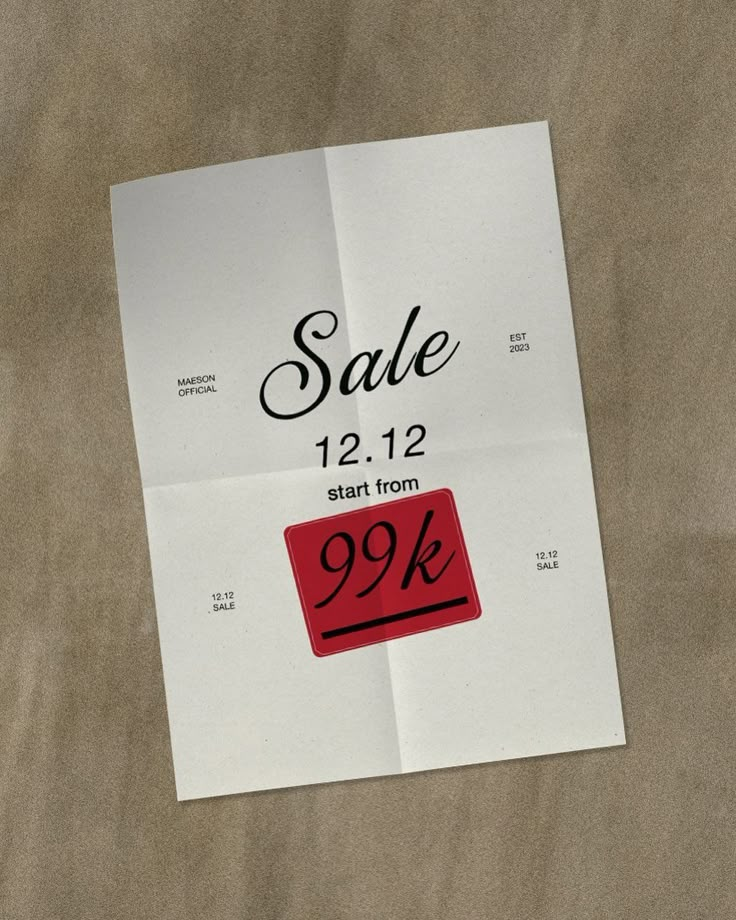 a white paper with a red sale sign on it