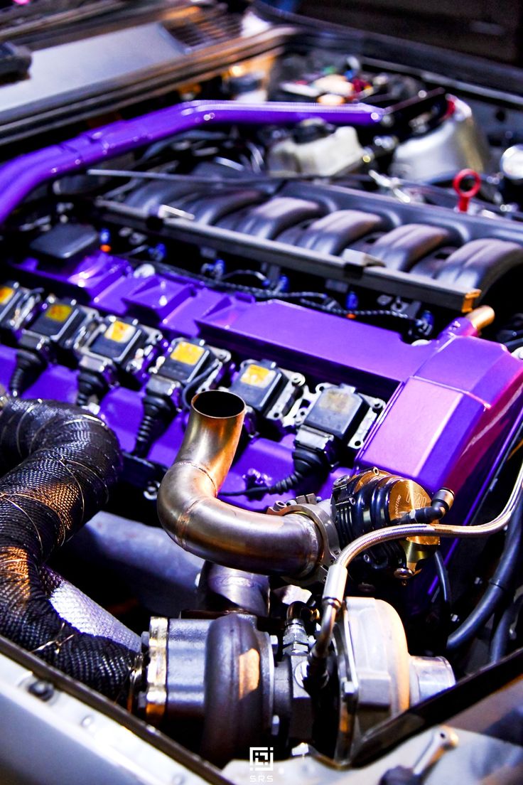 the engine compartment of a car with purple paint