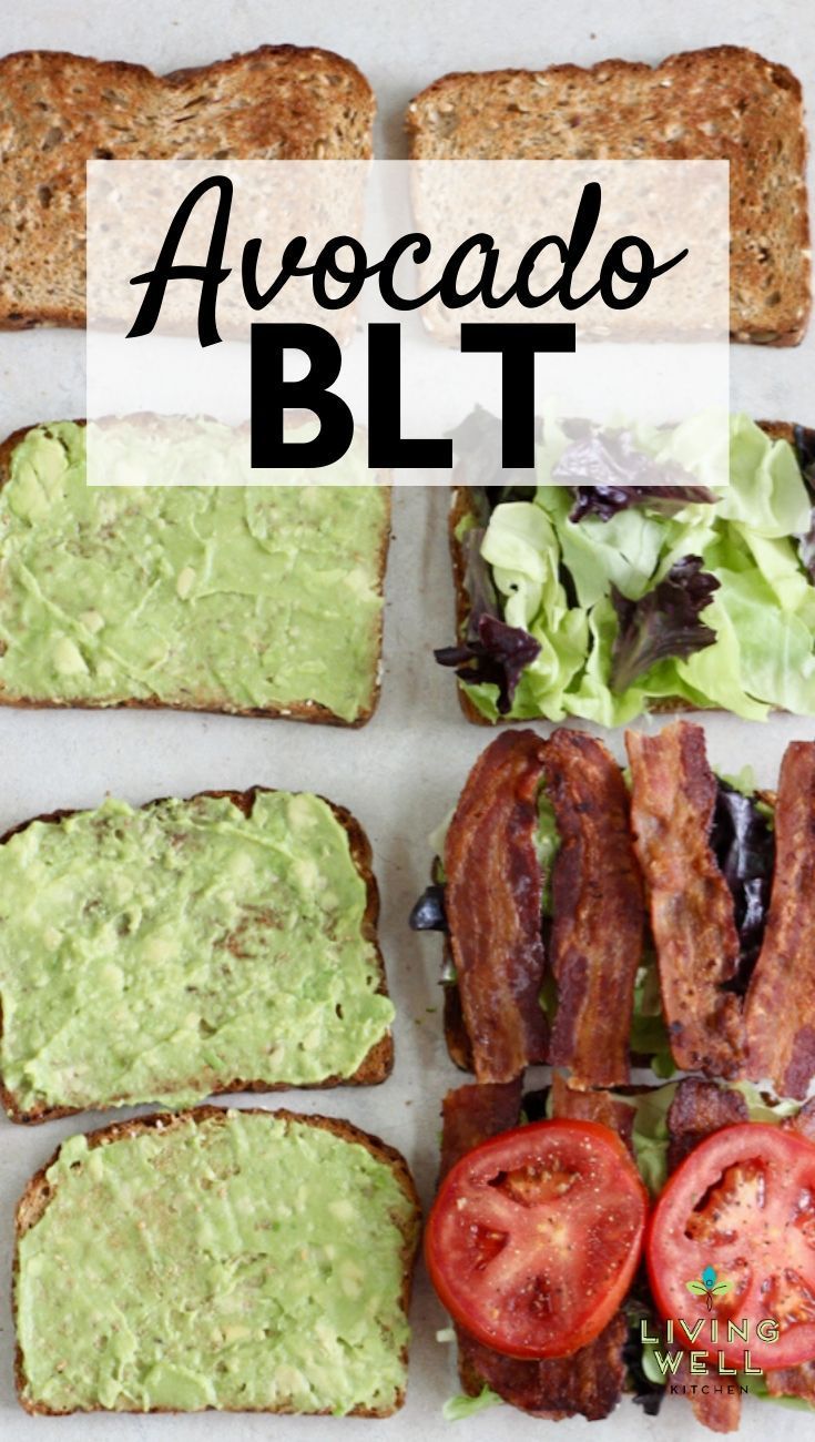 avocado blt sandwich with bacon, lettuce and tomatoes on toast