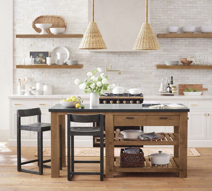 a kitchen island with two stools next to it