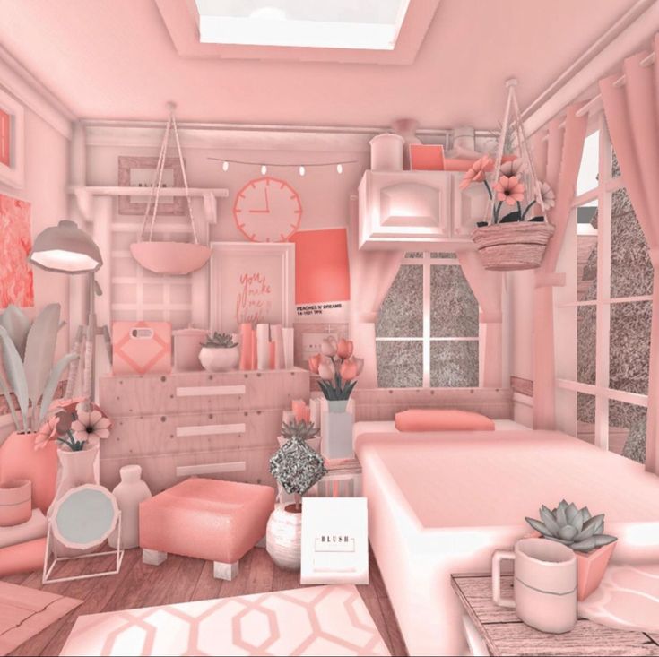 a pink room filled with furniture and decor