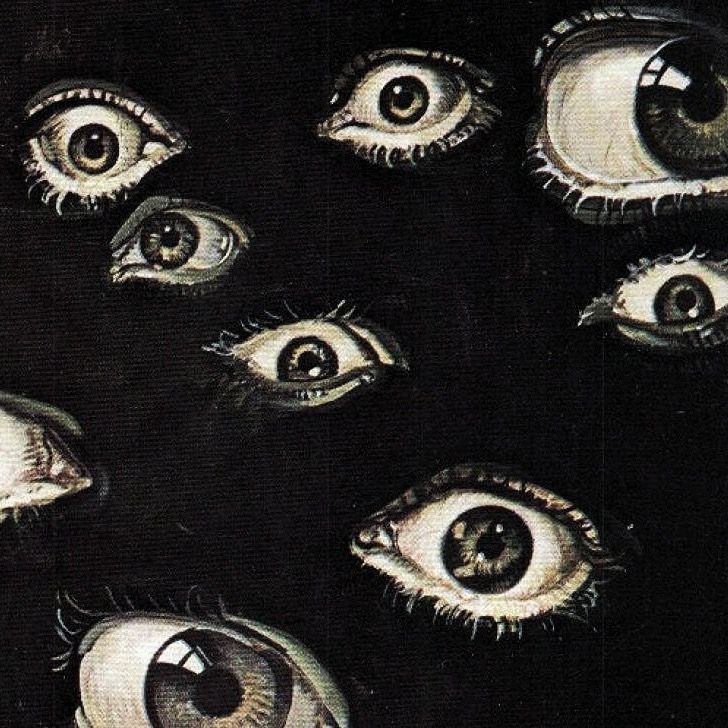 an image of many different eyes in the dark