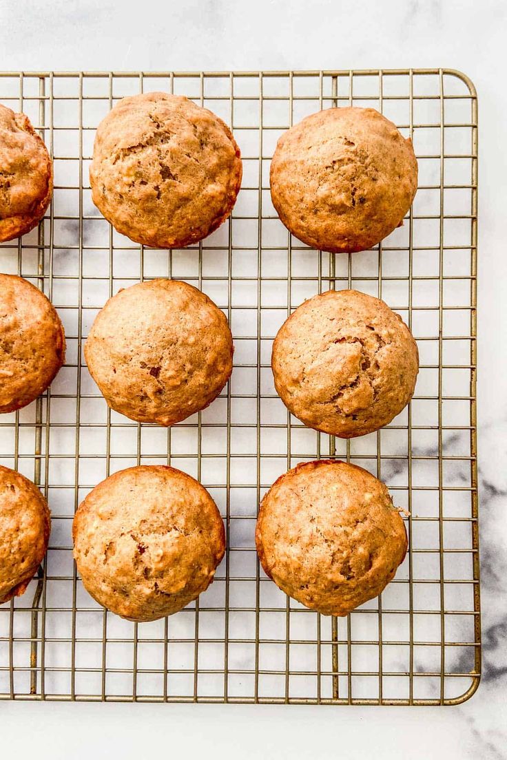 freshly baked muffins cooling on a wire rack, ready to be eaten for breakfast