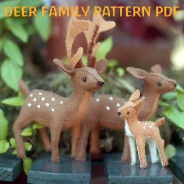 two deer figurines sitting next to each other