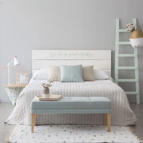 a bedroom with a bed and a wall sticker