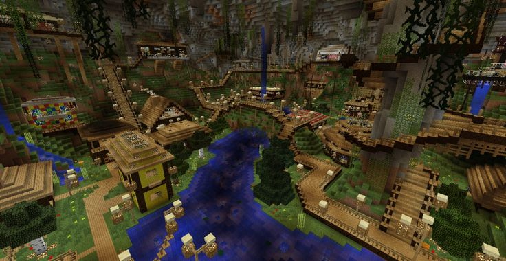 an aerial view of a minecraft village in the middle of a river and forest