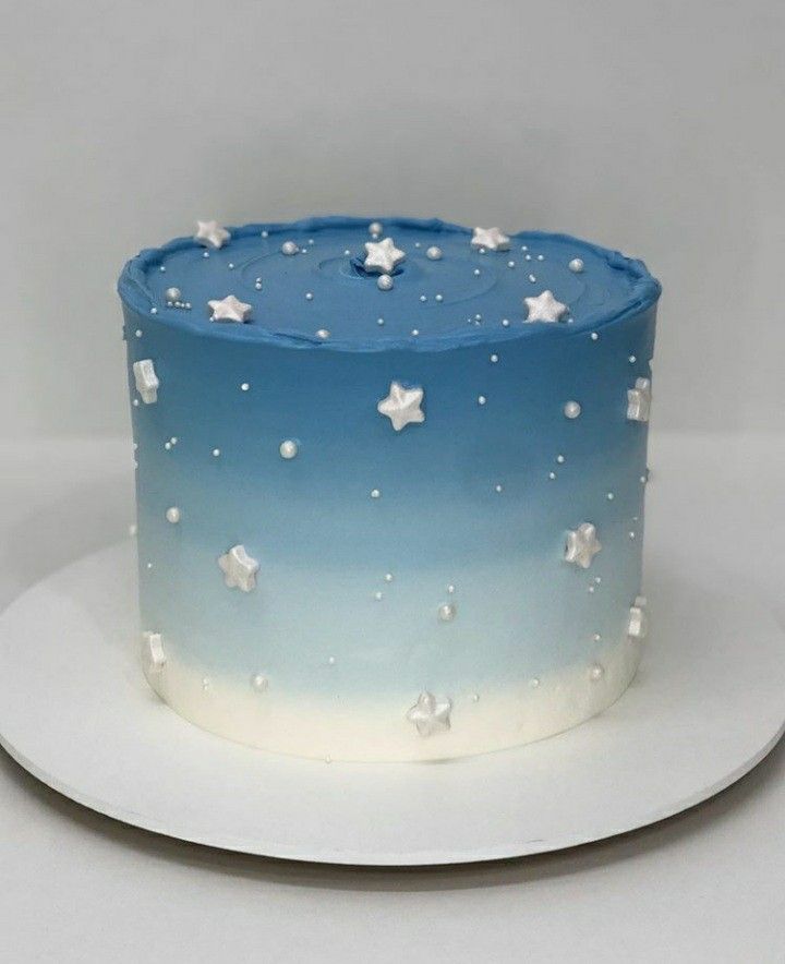 a blue and white cake with stars on it