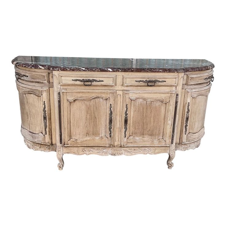 an antique style sideboard with marble top