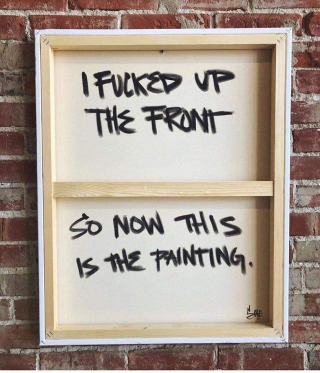 two wooden frames with graffiti on them against a brick wall that says, i fund up the front so now this is the painting