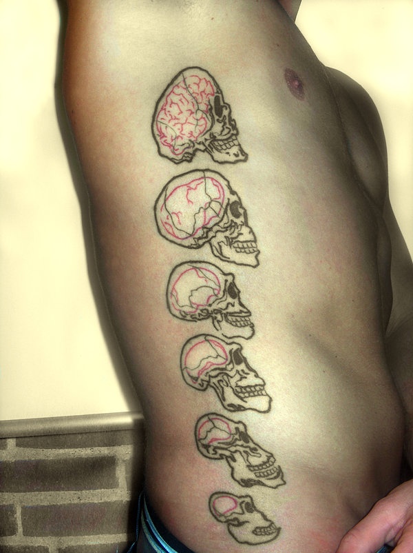 a man's back with different types of skulls on it