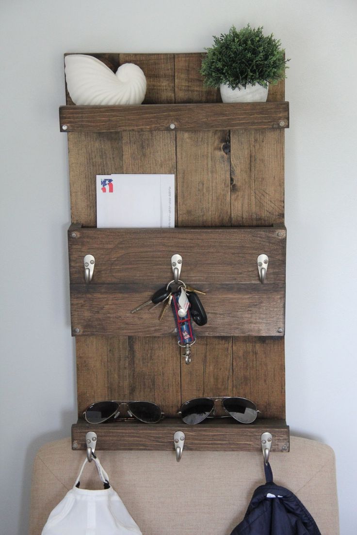 a wooden shelf with sunglasses and other items on it