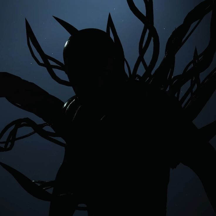 the silhouette of a creature with long hair