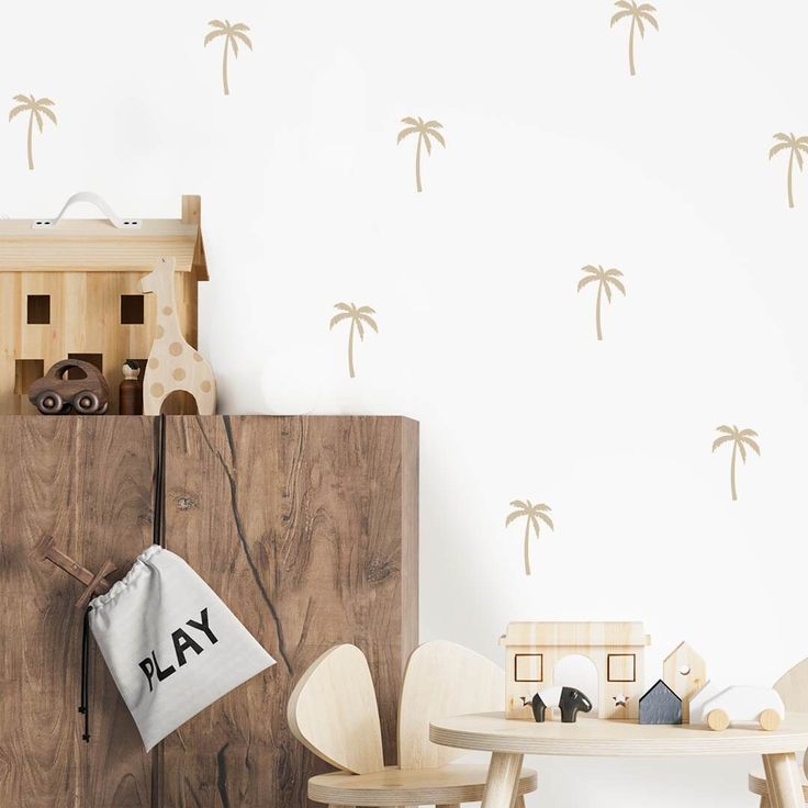 a playroom with wooden furniture and palm trees on the wall, including a toy car