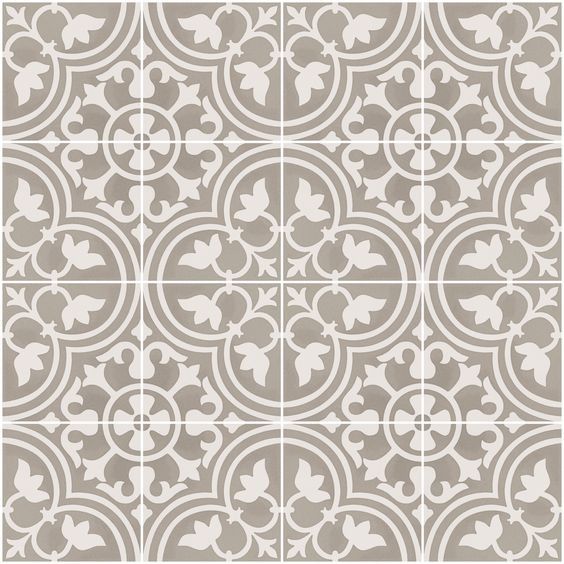 a gray and white tile pattern with circles, leaves and swirls on the sides